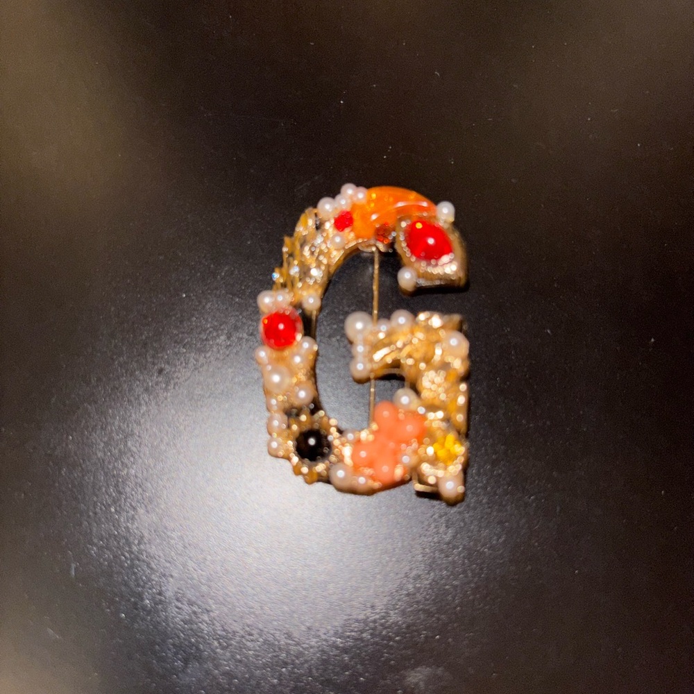 Elegant Gold and Red Beaded “G”Brooch